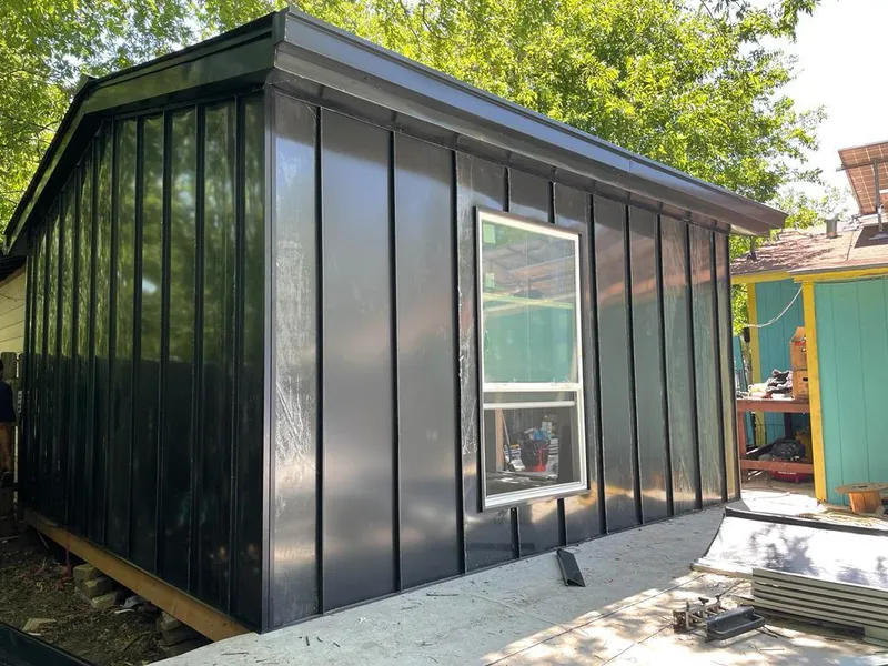 Black standing seam metal wall panels for Roof Inspection in Park